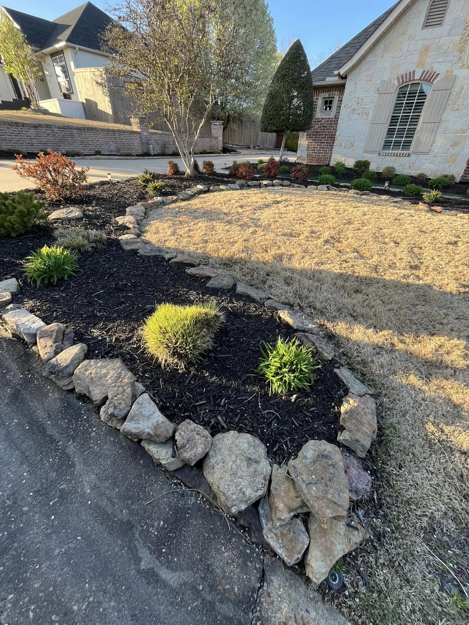 flowerbed with rock border