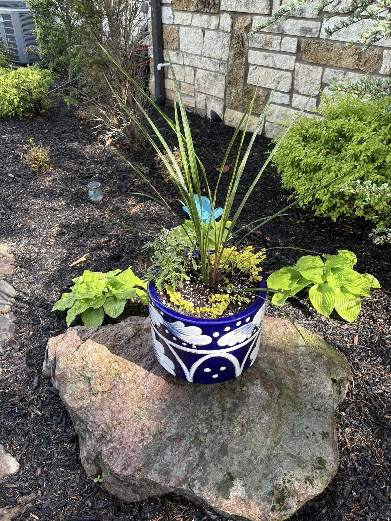 colorful flower pot in flowerbed
